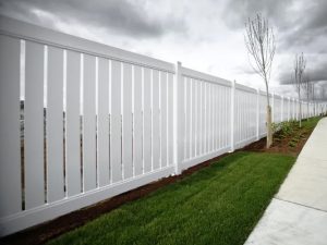 storm coming from behind a fence